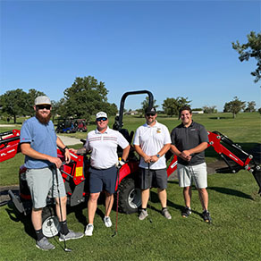 golf fore good people in front of tractor