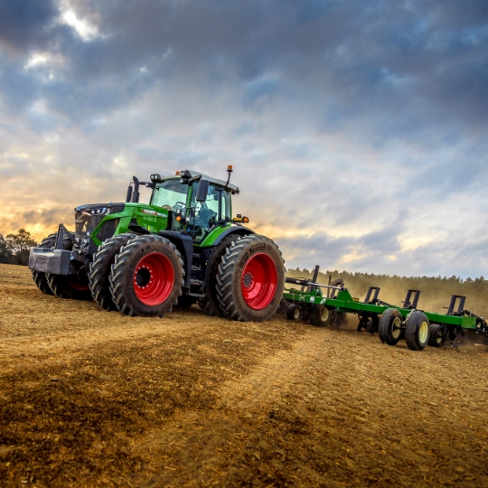 fendt 900 tractor with attachment in field 