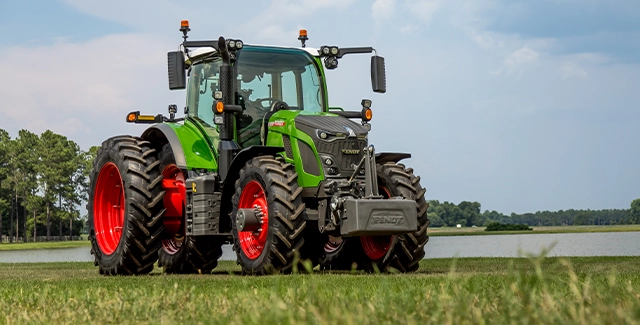 Fendt 600 Vario high-horsepower tractor, parked under a blue sky.