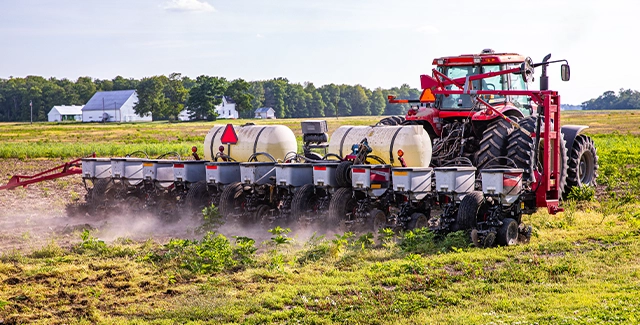 Massey Ferguson VE planter working in a field.