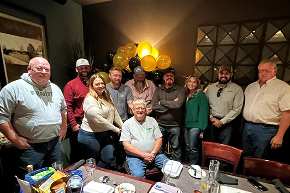 Agri-Service employee Mike Walker celebrating his retirement surrounded by family and friends.